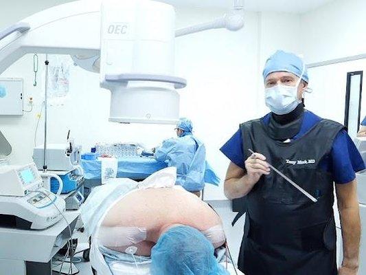 Picture of Dr. Mork performing an endoscopic spine surgery at his endoscopic spine clinic.