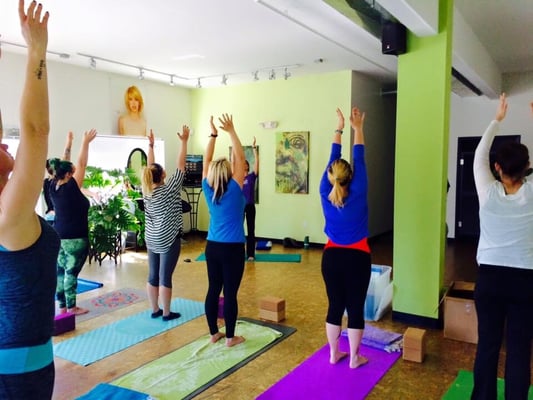 Team-Building yoga class for employees of Green Lotus Salon.