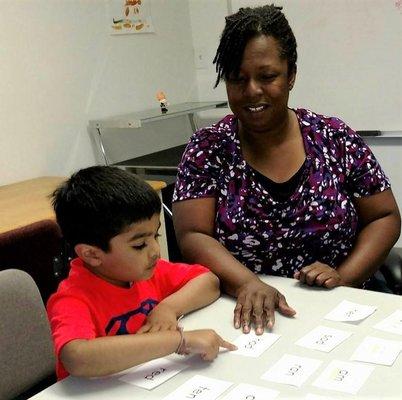 Owner working with an elementary student