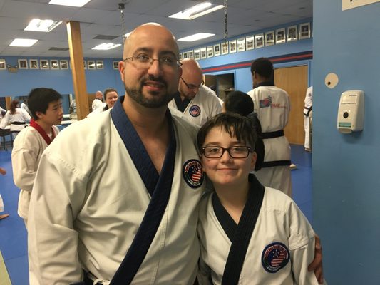 My son and I at the completion of his black belt testing for his second degree black belt