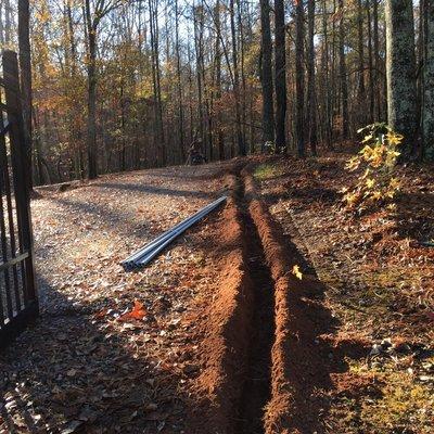 Trenching power for a gate opener and fence outlets.