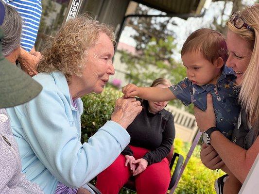 Baby visits on the patio.