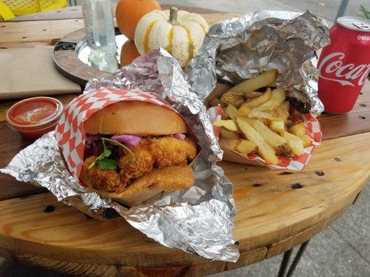 Chicken Katsu Sando... Cilantro, zesty mayo and red cabbage slaw on a Brioche bun! Side of fresh fries... yummmmm.