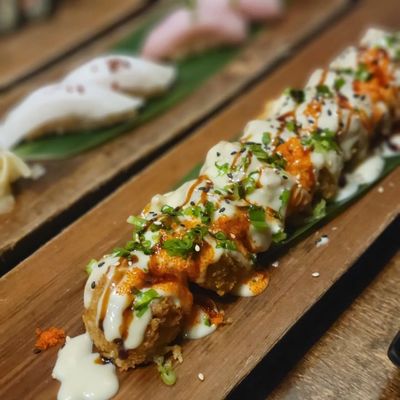 The Iron Fish Roll is thickly deep fried and smothered. Too much; not really sushi