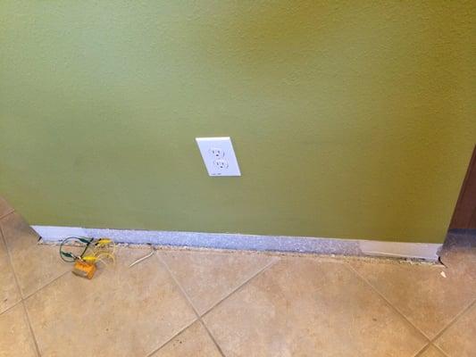 Baseboards removed. Meter to test dampness.