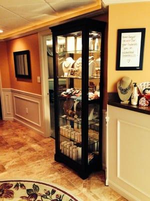 Jewelry & products on display in a beautiful curio cabinet!