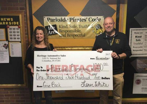 Parkside Pirates receive donation from Heritage Automotive Sales in Columbus.