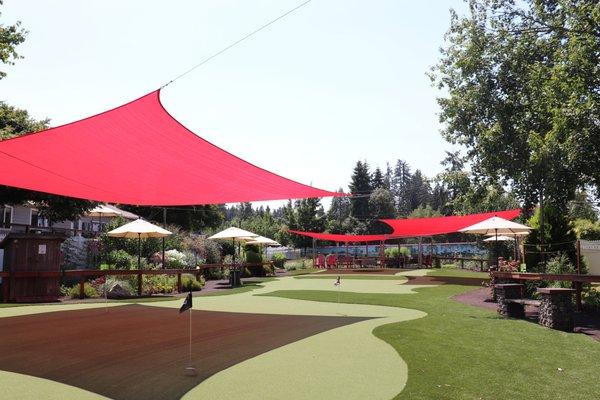 Shade sails fly over our village golf course.