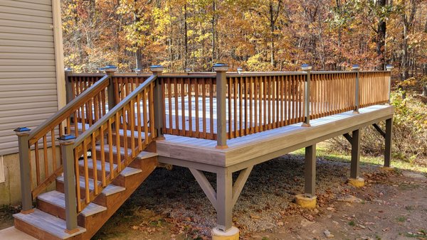 Tanzite stone deck and wooden rails