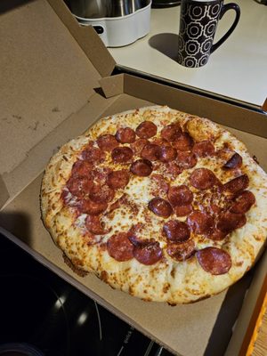 Pepperoni and alleged extra cheese