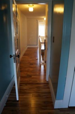 Upstairs floor install by Woodcraft. Natural pre-finished acacia.