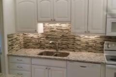 Kitchen - tile back splash, and granite countertop