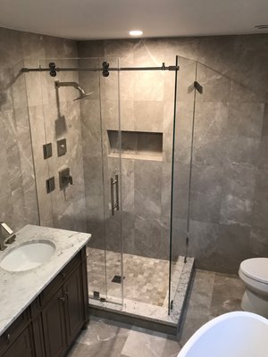 Frameless Shower Enclosure with return panel and custom hardware