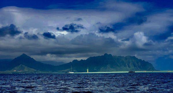 View from the boat, with sun and clouds.