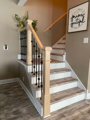 Cap-a-tread on stairs. Wood-look run and white riser.