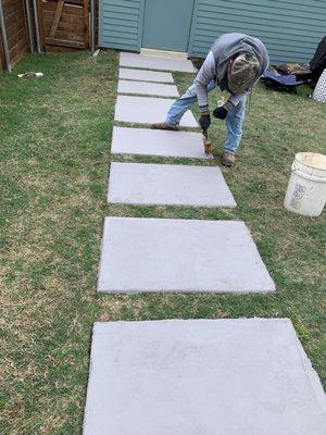 A sidewalk of individual concrete squares