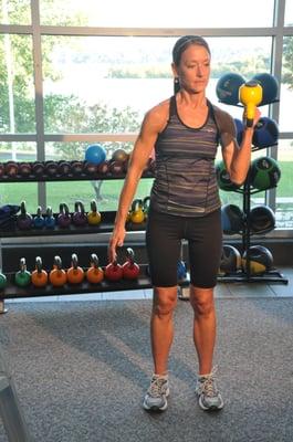 Training with a kettlebell in the Personal Training Studio overlooking the Illinois River.