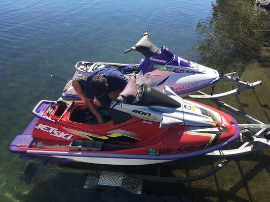 Tuning the jet skis before we take them out on a ride