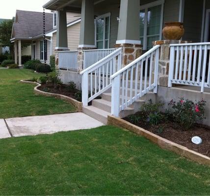 New Sandstone Borders, Plants, and Sod in Plum Creek.