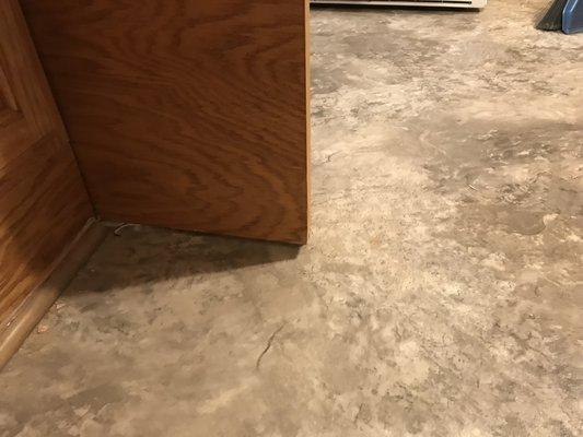 Shoe moulding left off, showing gaps all around the kitchen