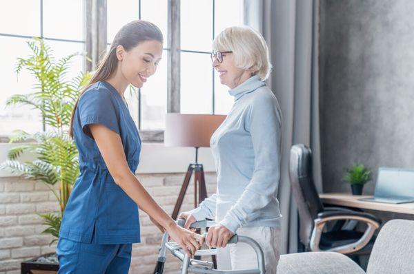 nurse assisting patient