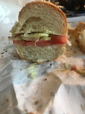 One slice of cheese, lettuce and tomatoes. AND A LOAF OF BREAD!