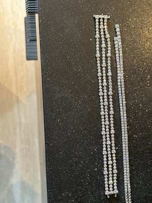 7.46 carats on the left.  Fortuna insists the necklace on the right is 8.25 carats.