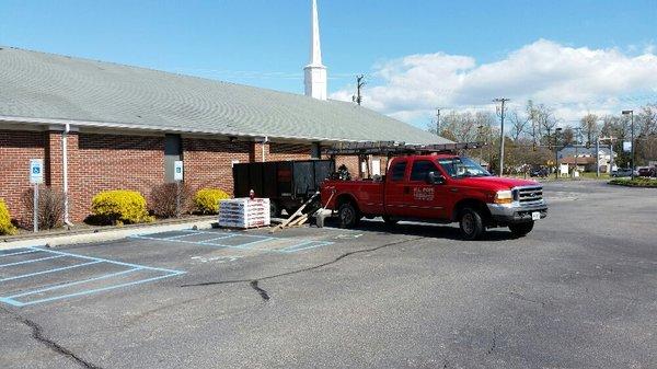 Installing new architectural roof on sanctuary at Good News Baptist Church