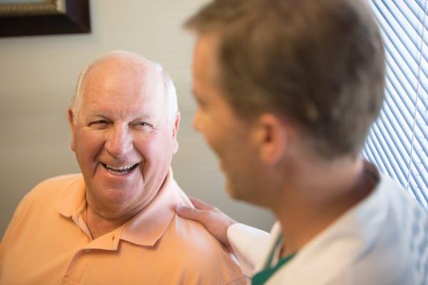 Dr. Mark Hardison consulting with a patient