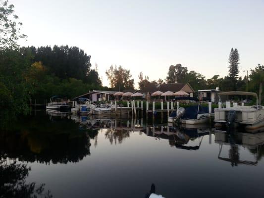 From the water looking at the patio and boat dock and ramp at the far left.