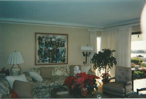 Complete redesign of living room in neutral eige with draperies and artwork