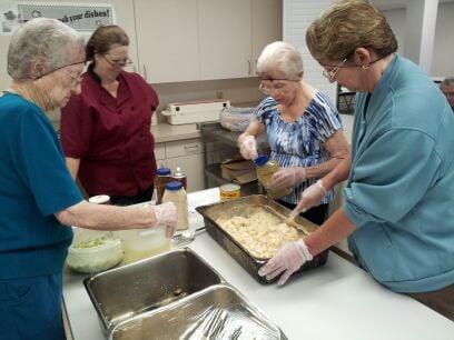 Residents participate in Cooking class with Dietary Director.