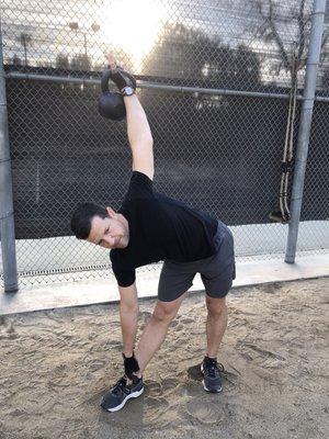 One of my clients demonstrating the Windmill exercise; great for strengthening the core muscles and stretching the hips.