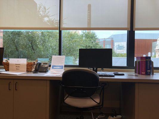 Research library computer station with a view of the Pearl