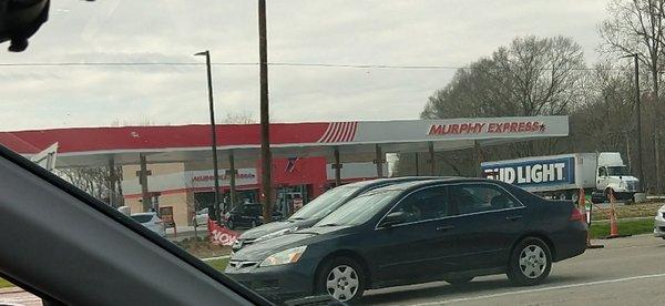 Very busy intersection for a gas station.