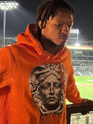 Orbit Orange Medusa Drip hoodie ...available in all sizes.