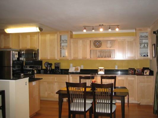 We transformed a condo into a great room entertainment area by custom building a whole wall built in & elongated buffet counter