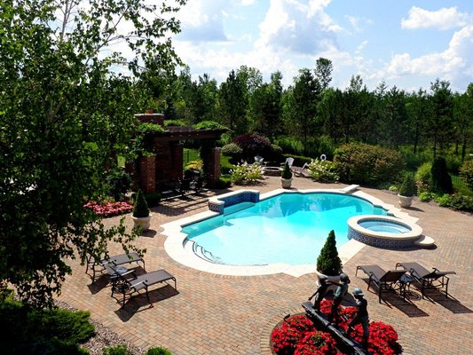 Paver patio surrounding pool