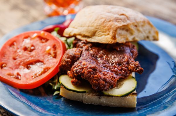 BUTTERMILK CRISPY CHICKEN
SANDWICH - Lunch Menu, crispy chicken in our signature Basquez sauce w/ pepino cucumbers and seasoned tomatoes