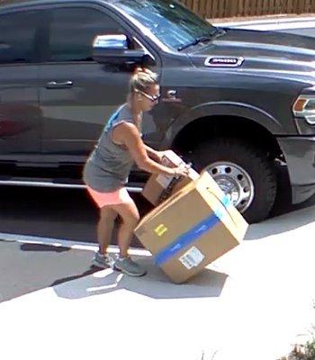 Rolling and kicking my package on the ground to the door.