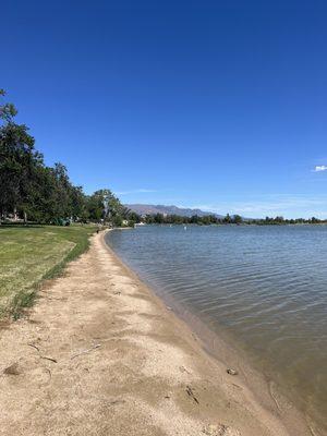 Small strip of sand surrounding the lake