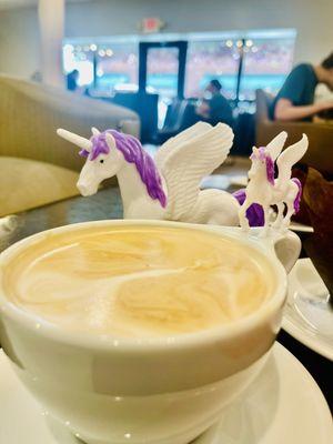 Coffee and tables in background. Unicorns not included we brought those from home