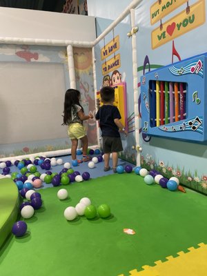 My baby boy playing with the wall toys