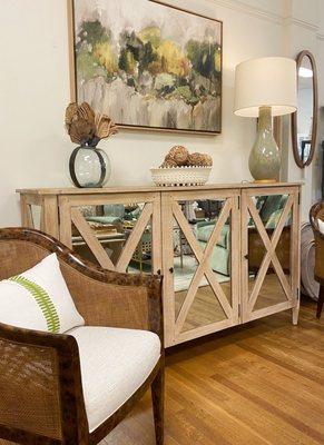 Our Genova Tortoise chair pairs perfectly with the 3-Door Mirrored Cabinet! Accenting with different hues of green.