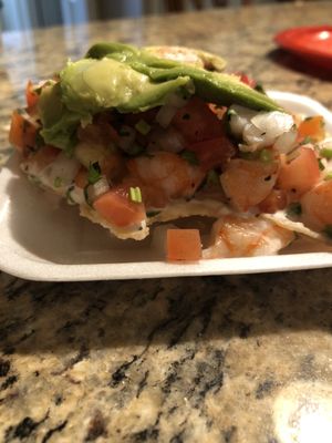 Ingredients are piled on to the tostada! So fresh!