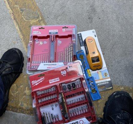 Drill bits, with their separate case. Leveler, stud finder.