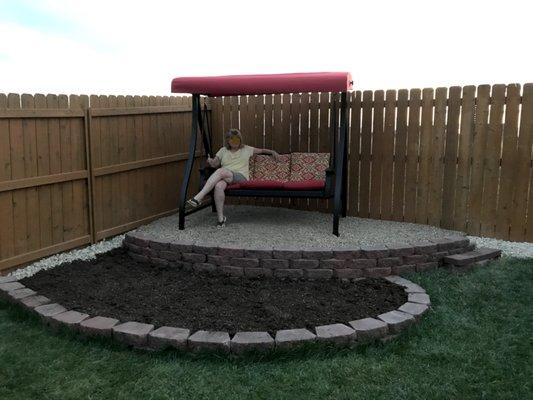 Double retaining wall with soft stone seating area and planter bed