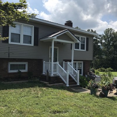 Home Renovation work completed; Vinyl Siding Installation, added new covered Patio (Front Entry), Metal Roofing Installation