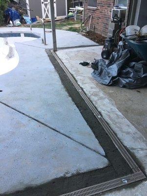 Area drain installed around a swimming pool