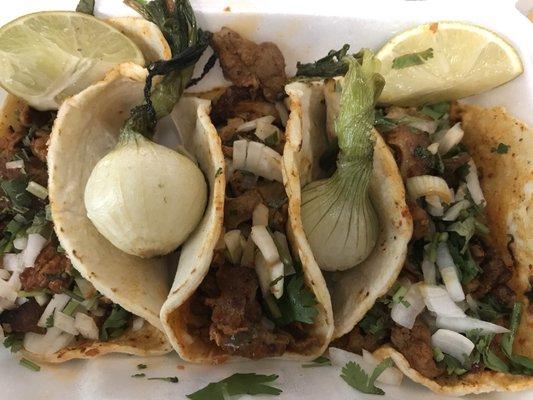 Now this is how Tacos el pastor should look like. Overstuffed with succulent grilled pork, onions and cilantro.